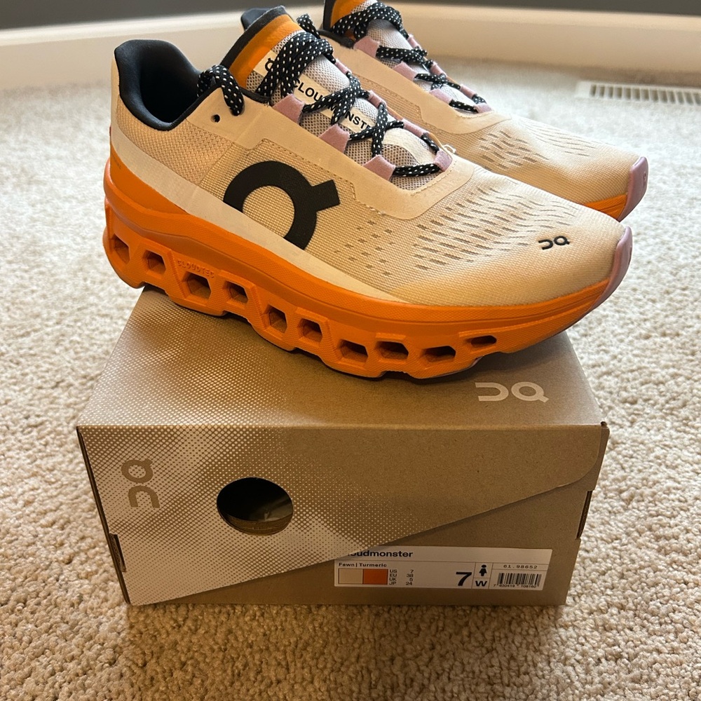 On Running Cream and Orange Athletic Shoes with Cloud Cushioning